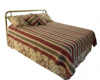 Brass Bed Frame with Floral Bedding and Striped Comforter second image