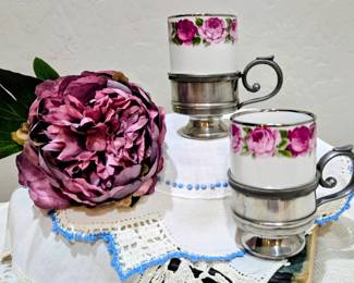 Pair of vintage porcelain cups with pewter holders