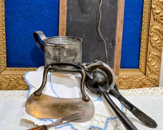Vintage cast iron citrus juicer, flour sifter, etc