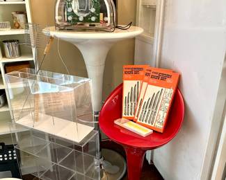 A vintage 1980s Prosonic Neon Radio featuring a clear acrylic case showcasing its internal electronics; stainless steel kitchen knives sets with rosewood handles, in original boxes; a red and chrome retro-style bar stool, an adjustable white pedestal pub table with a trumpet or tulip-style silhouette