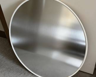 One of two vintage minimalist Umbra Hub 24" round wall mirrors available at this estate sale
