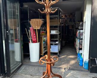 A stunning antique Thonet-style bentwood coat tree with eight double hooks for coats & hats anchored by an umbrella rack – it serves as a coat rack, hat rack, cane rack and umbrella stand all at once. These very elegant and graphic curved shapes are a reflection of the Art Nouveau and Jugendstil eras.