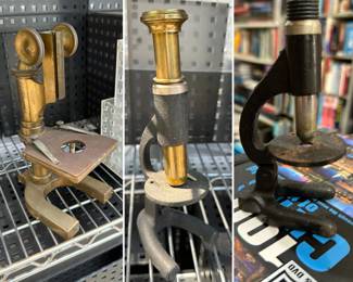 Three vintage brass and cast iron microscopes