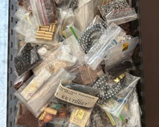 A large assortment of mixed craft beads and jewelry findings