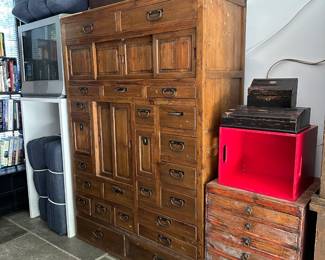 Antique Japanese choba tansu (merchant's chest) originally made for shopkeepers and traders. Used to store documents, ledgers, and shop goods. Multiple graduated drawers and sliding compartments; hand-forged iron hardware. 48"W x 19"D x 67"H.