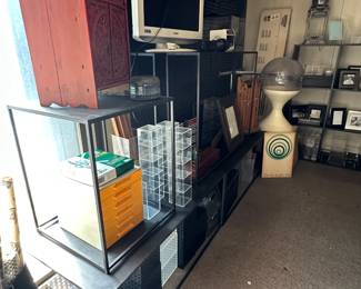 A vintage Asian carved wood two-door stationery cabinet, acrylic collection boxes, perforated metal and plastic storage containers, a mid-century modern MCM '60s-'70's vintage Knoll tulip base style terrarium/planter, book cases, shelving units