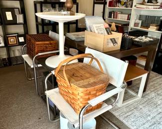 Vintage picnic baskets, a pair of Marcel Breuer-inspired arm chairs on tubular metal frames, a SÄNDSKAR tulip side table designed by Thomas Sandell, Sweden; tables, book cases, photo and picture frames, vintage Letraset dry transfer lettering sheets in various fonts