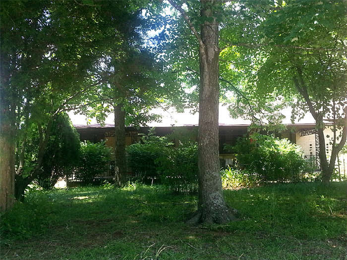 1450 sq. ft. brick veneer and siding home on 1 +/-acre. Home features good garden spot, paved driveway,  covered front porch, two car attached garage, 3 bedrooms and 2 baths. Newly updated bathrooms, custom cabinets, separate laundry room.