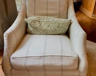 Upholstered striped armchair with accent pillow