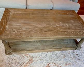 Whitewashed wood coffee table with lower shelf