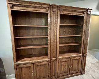 Large oak double bookcase with cabinet doors, pillars
