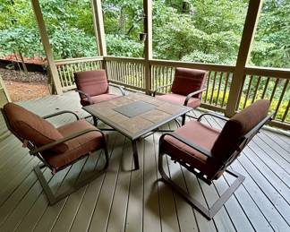 Patio tile-top table with 4 cushioned chairs