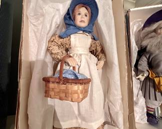 Porcelain pioneer girl doll, bonnet and basket, boxed