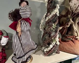 Victorian-style striped harlequin figurine on gold base