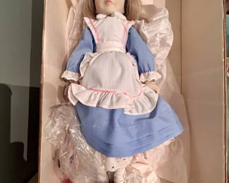 Porcelain Alice in Wonderland doll, boxed, blue dress