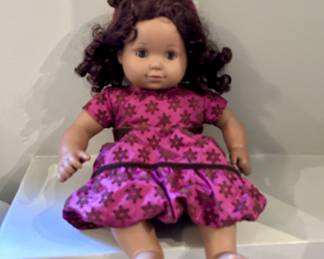 American Girl Bitty Twin doll is featured wearing the retired Sweet Snowflake dress