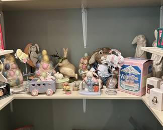 Shelves of Easter decor & Hallmark Keepsake Christmas ornaments lot