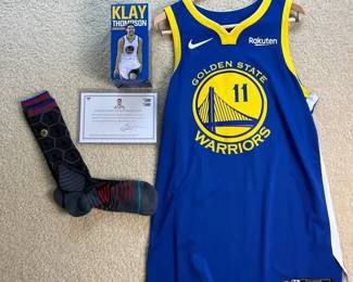 Golden State Warriors Klay Thompson Nike Jersey, Bobblehead, Authenticated Game Worn Socks.