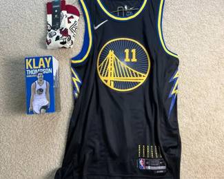 Golden State Warriors Klay Thompson City Edition Nike Jersey, Bobblehead, and KT Branded Socks.