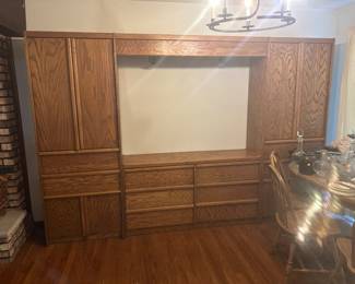 $190.00 Big lighted storage wall unit solid heavy wood with drawers. 60 tall, 17 deep, 30 across, if you don’t use the top, and just bottom drawers those measure 60 long and31 tall.