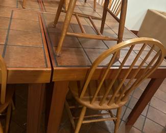Choice of 4 hand made tile table at $50 each. Choice of 16 solid wood chairs $18 each.