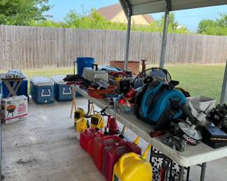 gas cans, coolers, fishing tackle, grill, cool air misting system