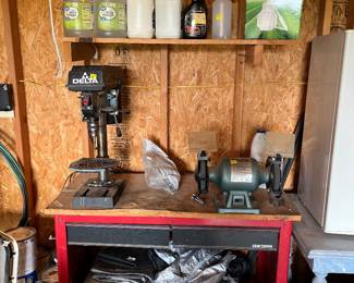 drill press, bench grinder, work bench, mini fridge, table