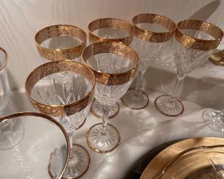 Vintage crystal stemware with gold-encrusted band along the rim