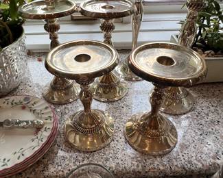 Variety in sizes of metal pillar candle stands