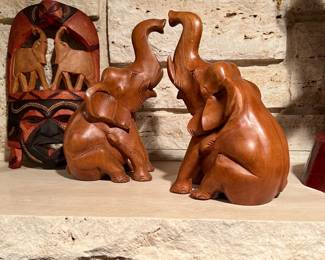 Vintage hand-carved seated wooden elephant figurine