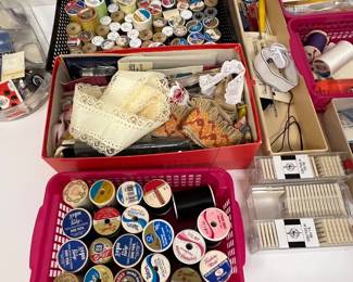 Variety of colorful thread and needles