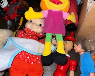 Variety of vintage and modern dolls