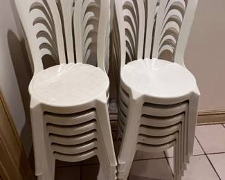 White plastic monobloc stacking patio chairs