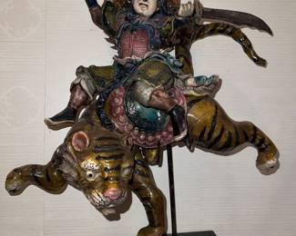 Chinese warrior riding a tiger