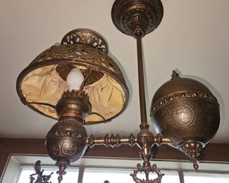 Antique oil desk lamp that was electrified and turned into a chandelier