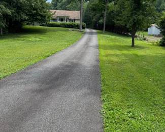 Park in the grass on either side of driveway.