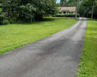 Park in the grass on either side of driveway.