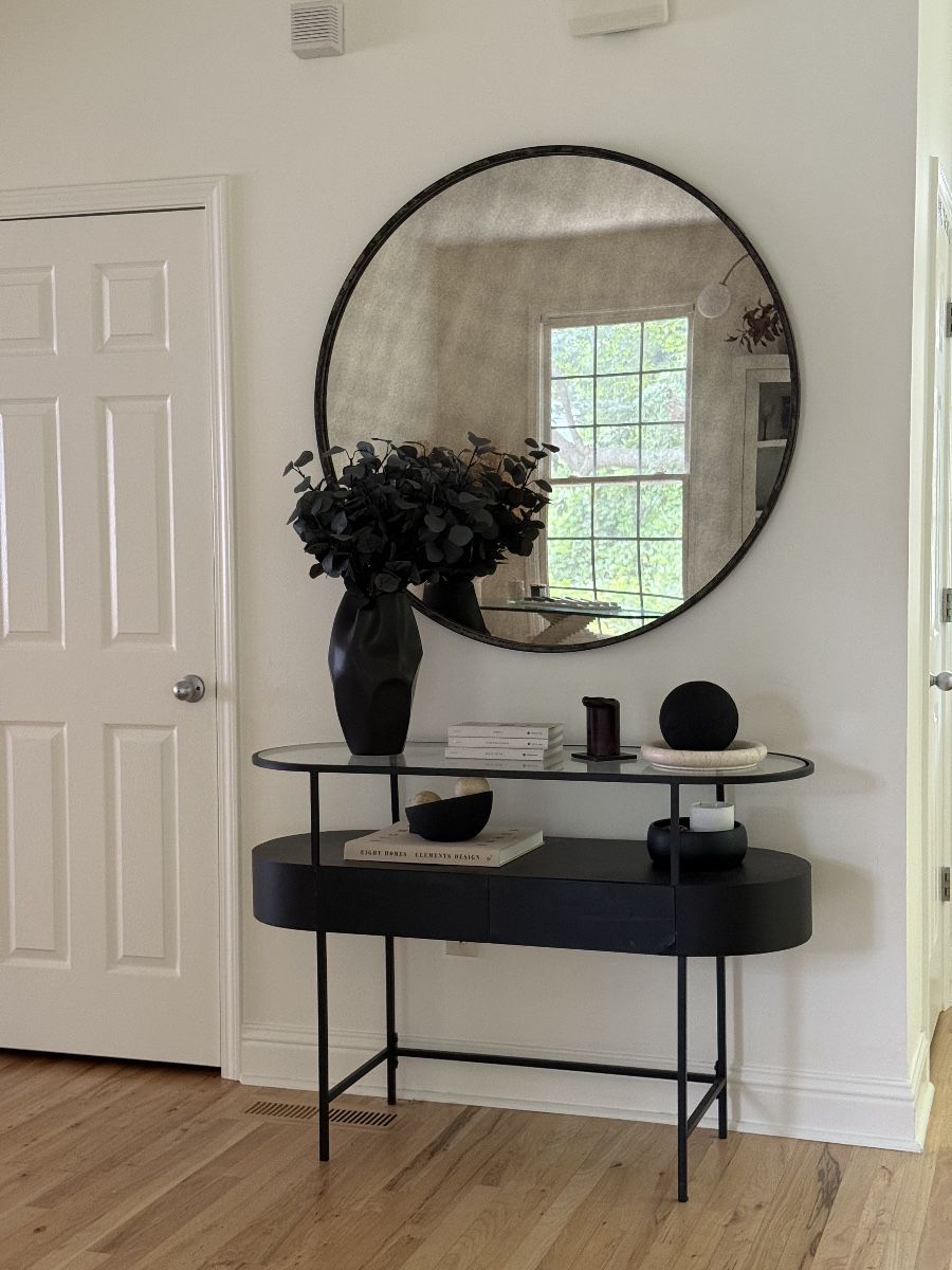 Console table, mirror, and decors
