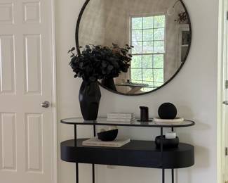 Console table, mirror, and decors