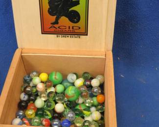Lot 367. Marbles in a wooden cigar box