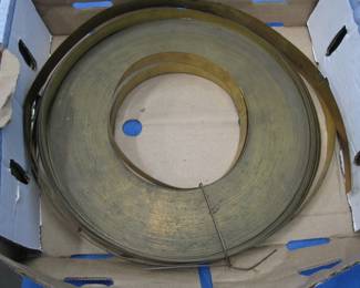 Lot 389. Approx. 21 lbs. of 7/8" brass shimming material