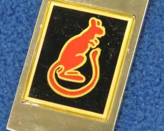 Lot 50. Franklin Mint's sterling silver 7th Armoured Division United Kingdom ingot from "The World's Greatest Regiments" weighing 23.47 grams.. All 50 emblems and the wooden display case will be sold separately in this auction