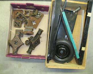 Lot 234. Pipe dies and a wooden crate of scrap metal