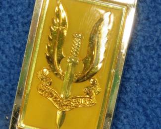 Lot 100. Franklin Mint's sterling silver The Special Air Service United Kingdom ingot from "The World's Greatest Regiments" weighing 23.10 grams.. All 50 emblems and the wooden display case will be sold separately in this auction