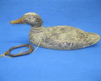 Lot 419. Wooden hen mallard decoy with glass eyes and a Herter's weight