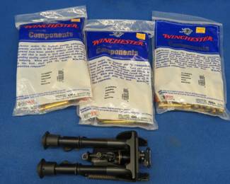 Lot 411. 150 Winchester 257 Roberts unprimed casings and a bipod