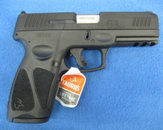 Lot 319. Taurus G3 9mm semi-auto pistol. S/N ADD272100. Includes two magazines, original box, manual, and a case.