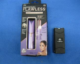 Lot 433. Personal grooming device and an untested Vipertek stun gun