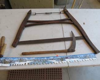 Lot 333. Painted cross-cut saw, buck saw, and a small scythe