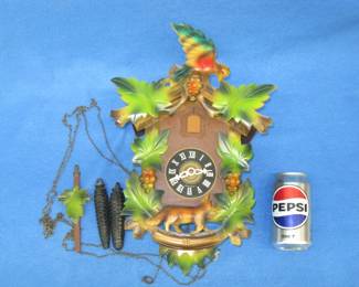 Lot 382. Colorful cuckoo clock in good working condition.